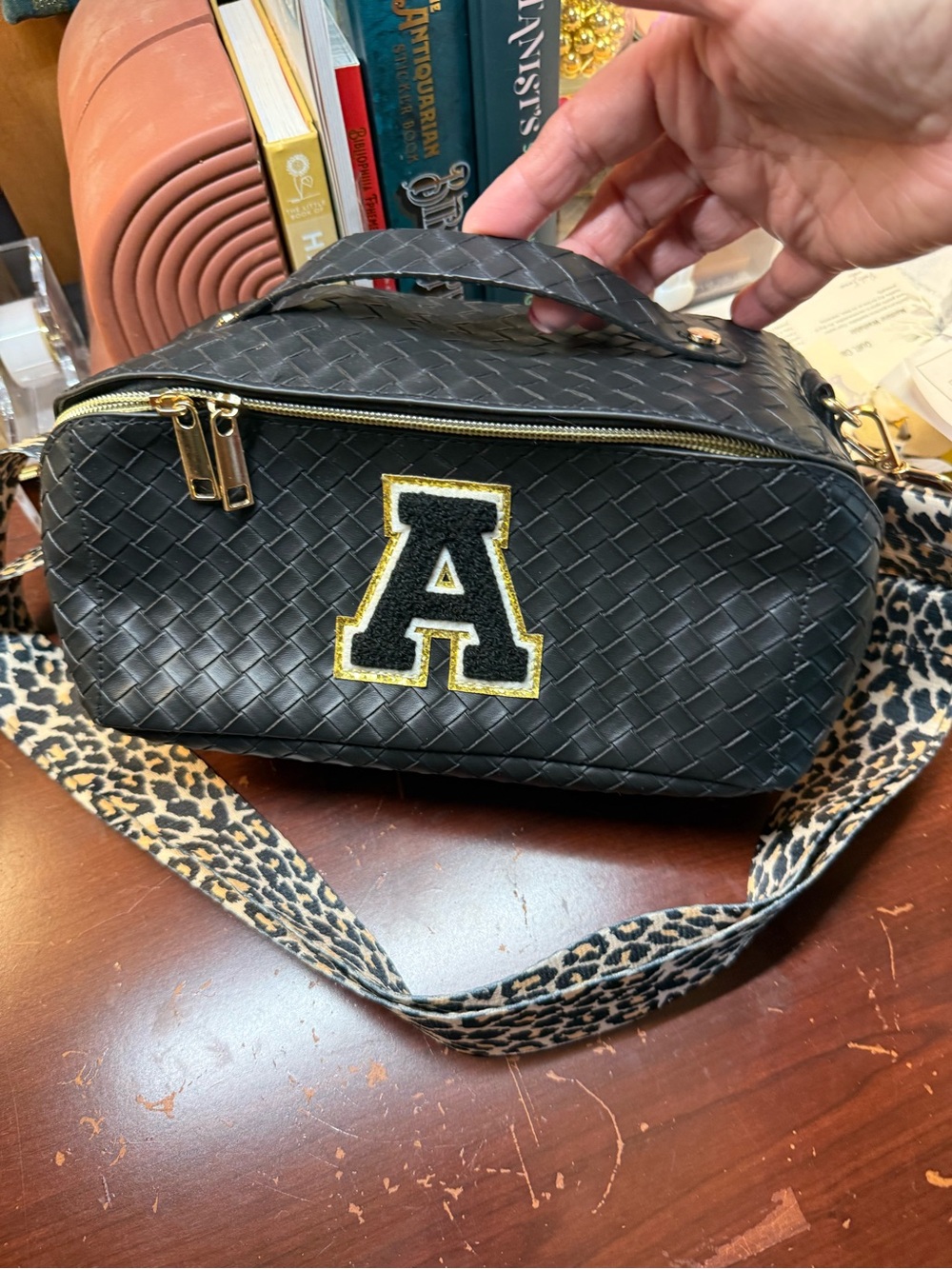Black Woven open flat travel/Crossbody Bag with Gold 'A' Patch and Leopard Strap